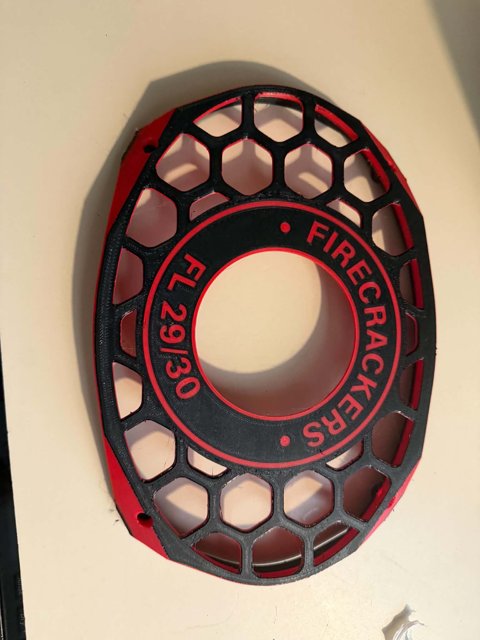 Black custom grill with red accent layers and red lettering